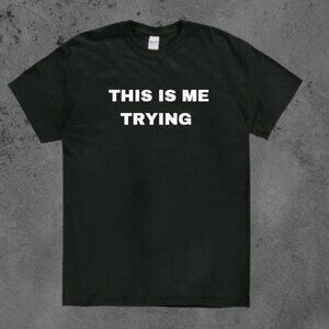 Keep it real with this black tee that says THIS IS ME TRYING in bold white text.